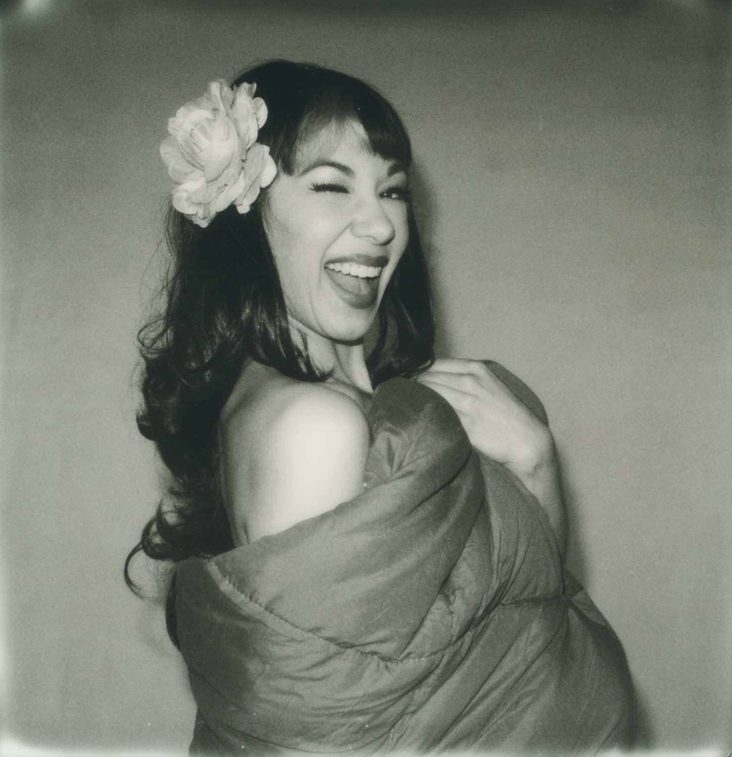 Model shot at angle in black and white, utilizing the natural light and background