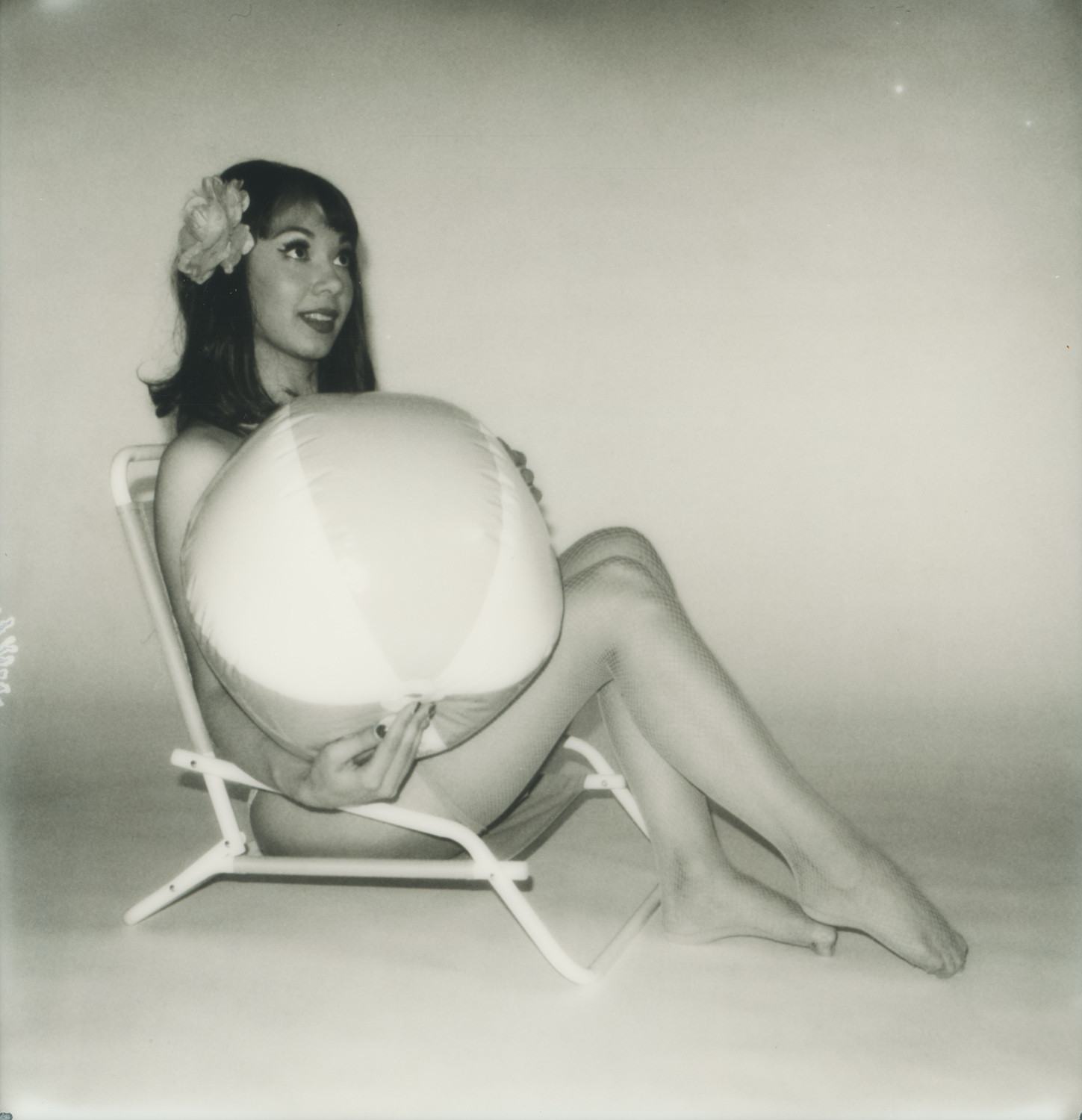 Model posing and camera angle for ideal shot in a black and white photo