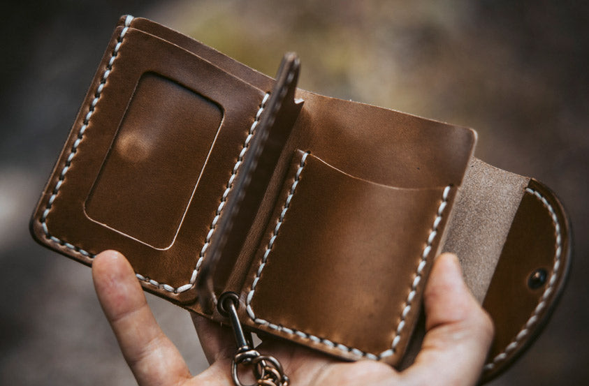 hand holding the Natural Biker Wallet
