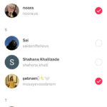A person holding a smartphone using TikTok and sending messages.