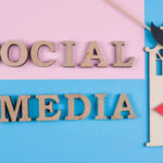 Social media text abstract wooden letters representing content sharing on platforms like Instagram
