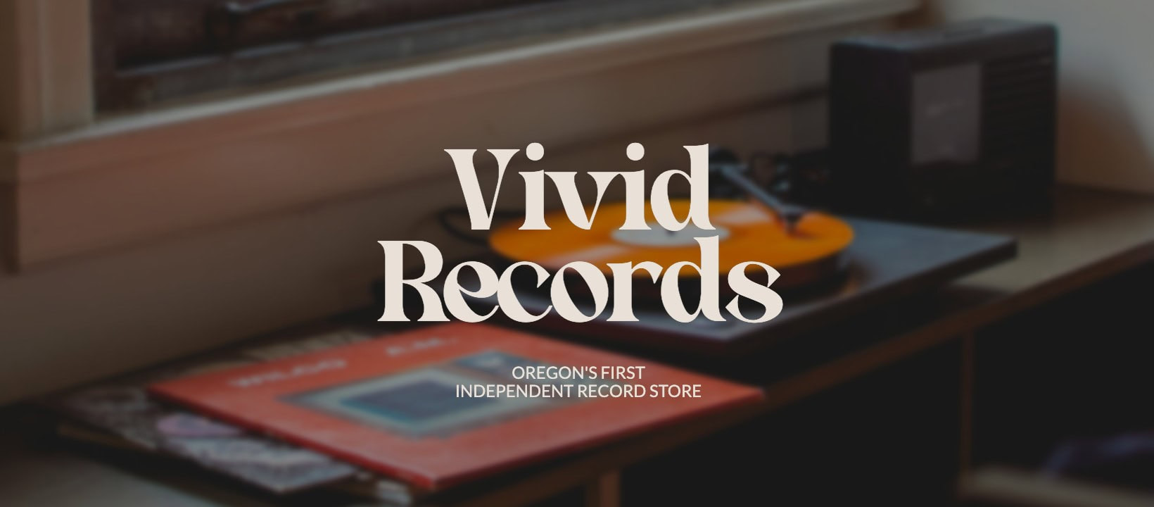 Facebook cover photo with bold text overlayed on top of a dark background photo of a record player
