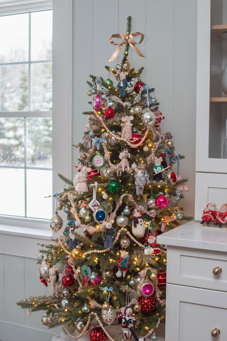Photo frame ornaments on a Christmas tree, showcasing alternative ways to display memories during the holidays.