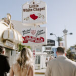 Couple walking to A Little White Chapel, capturing the charm and excitement of their special day