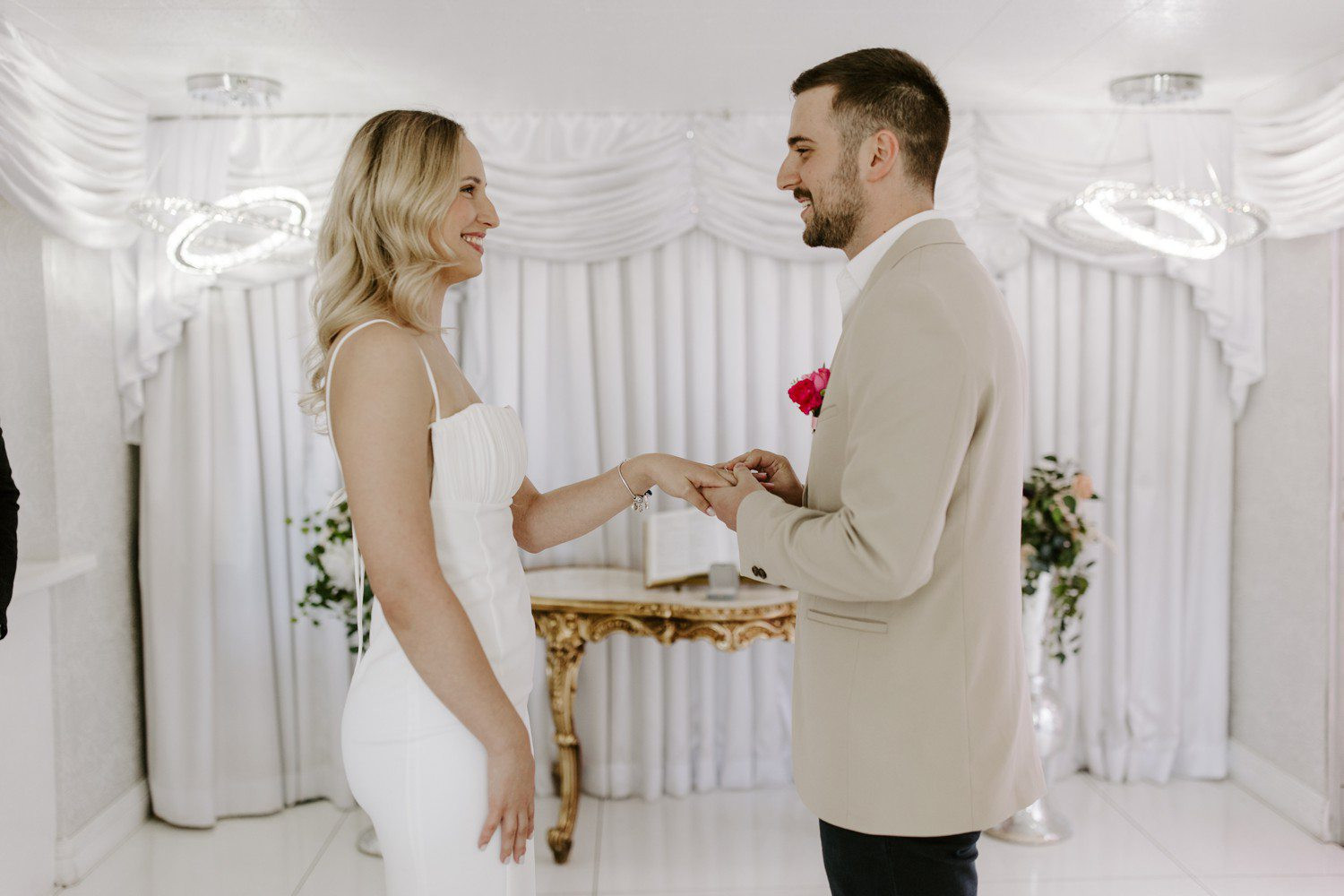 Couple exchanging rings during Las Vegas Elopement, encapsulating the emotional exchange and commitment