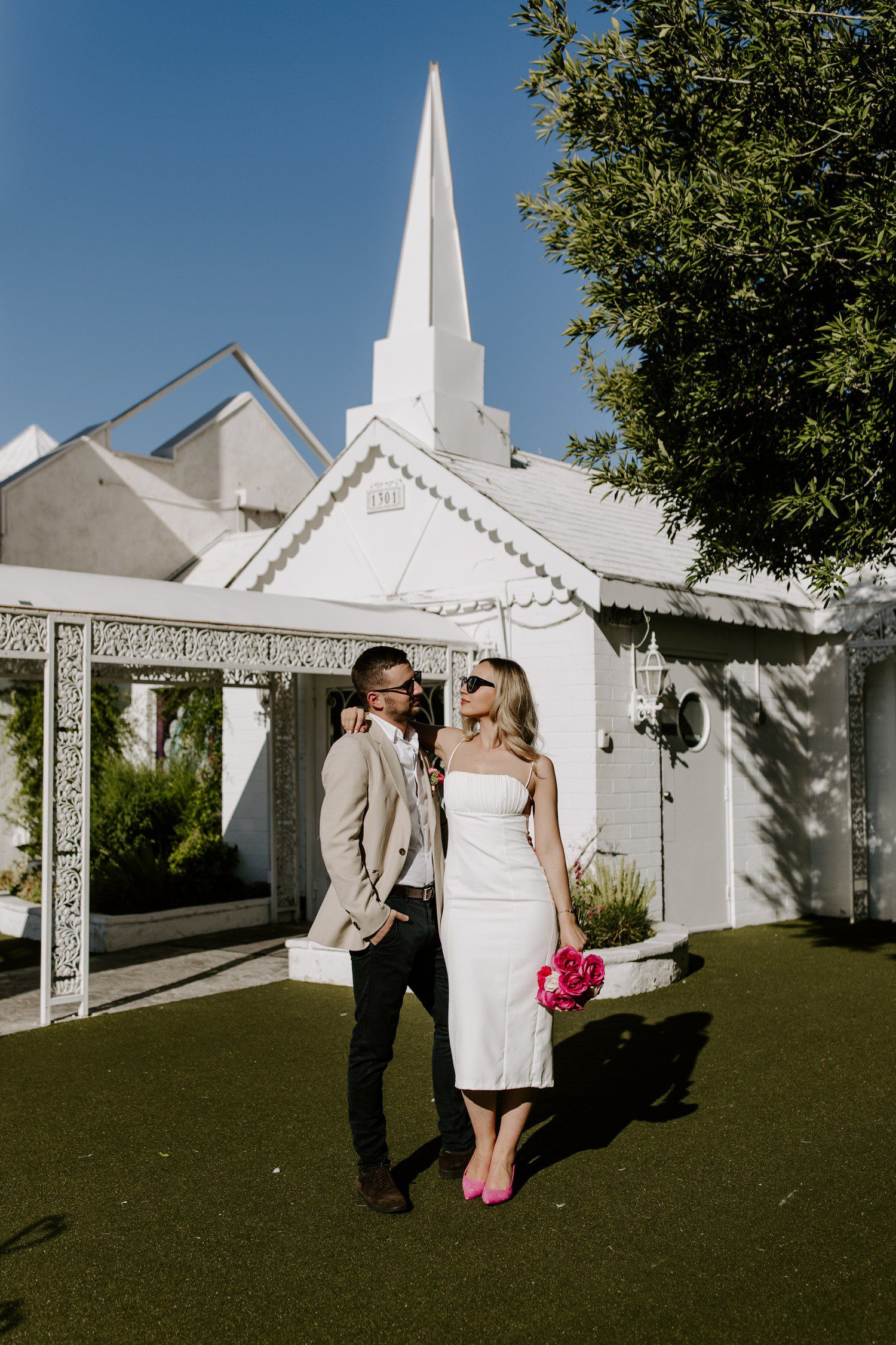 Wedding photos outside of A Little White Chapel, showcasing the classic architecture and joyful atmosphere