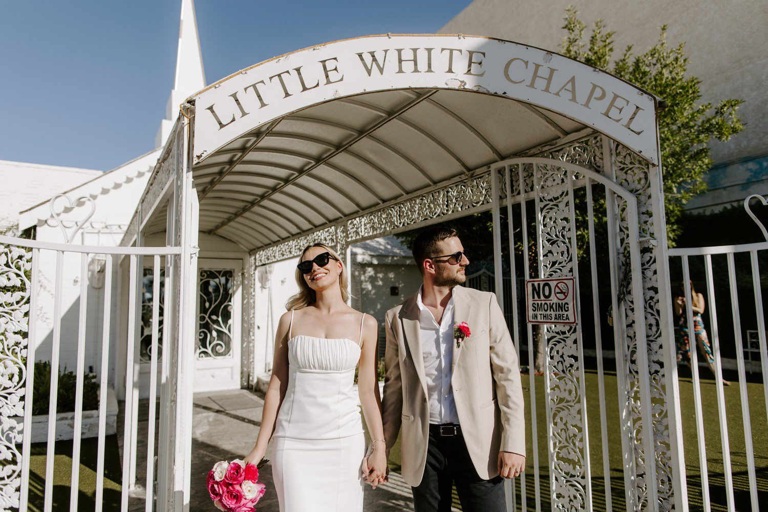 Elopement photos outside of A Little White Chapel, capturing the spontaneity and joy of the occasion