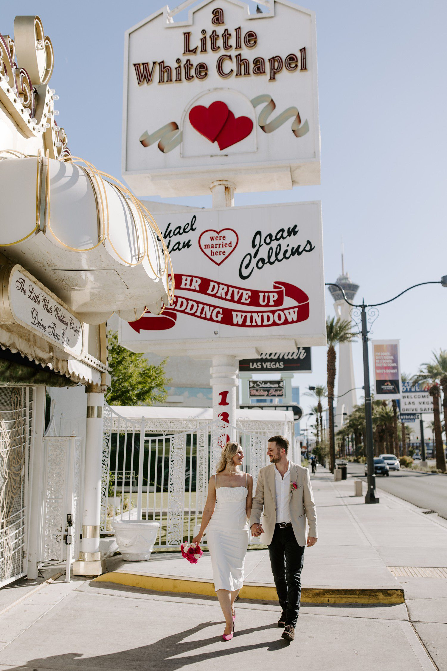 Wedding photos outside of A Little White Chapel sign, highlighting the couple's joy and the iconic venue