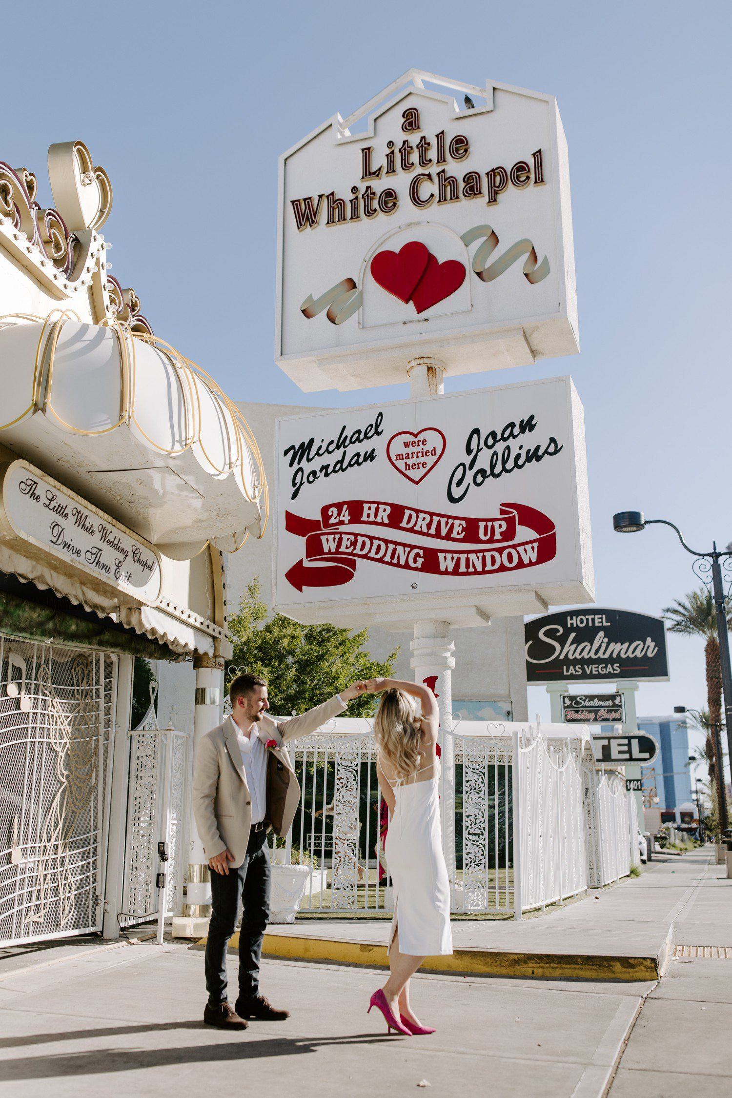 Couple dancing outside of A Little White Chapel, capturing the celebration and fun of the wedding day