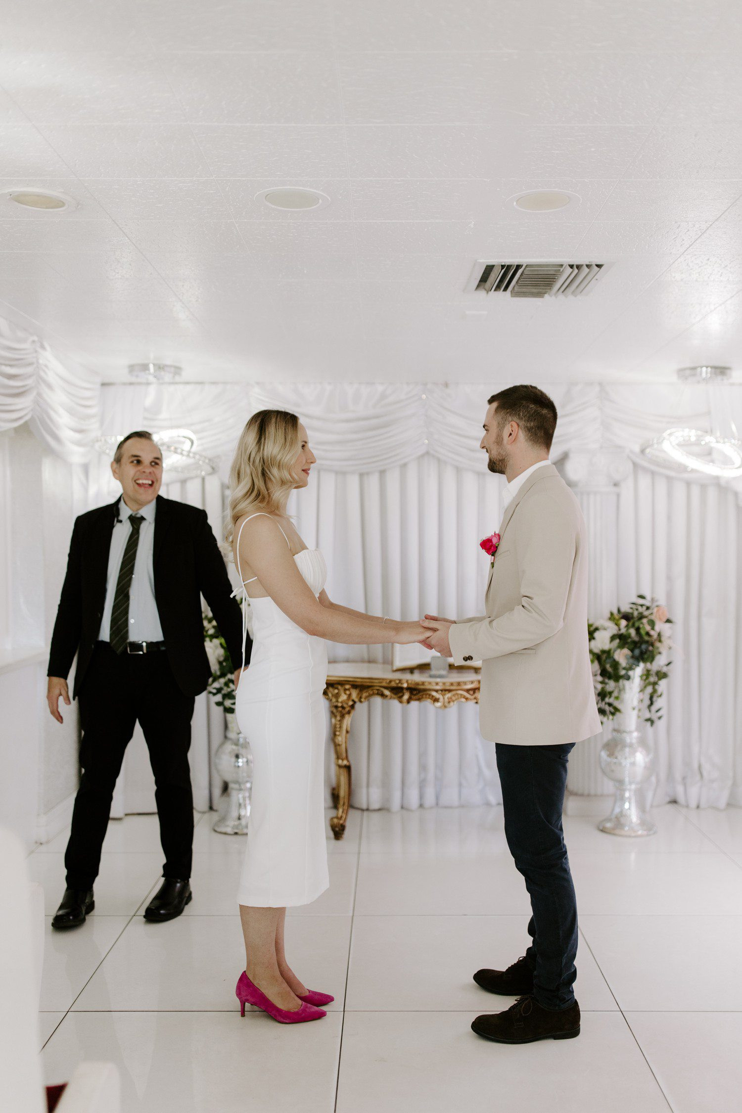 Wedding ceremony at Las Vegas chapel, capturing the intimate moment of exchanging vows