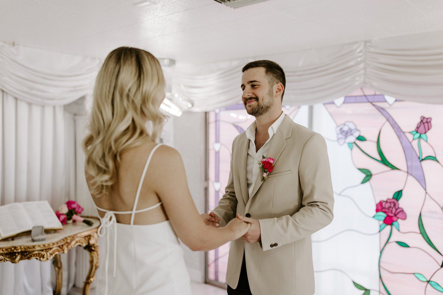 Wedding ceremony at A Little White Chapel in Las Vegas, emphasizing the architectural details and romantic setting